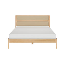 Light oak platform bed with woven rattan headboard and white mattress, minimalist mid-century modern bedroom furniture