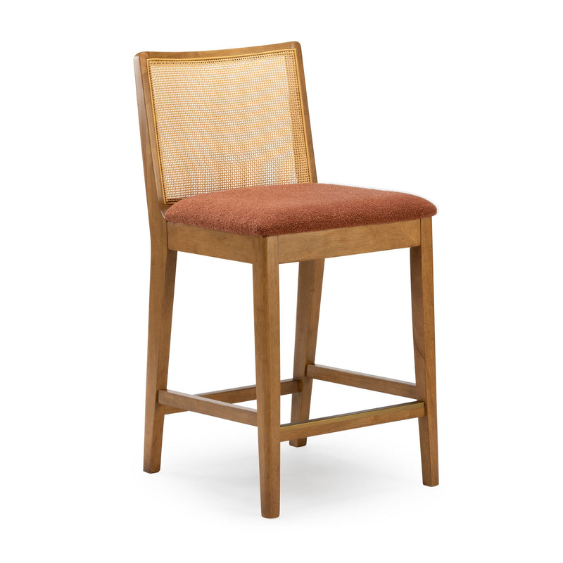 Mid-century modern wooden bar stool with woven cane back, rust upholstered seat and brass-tone footrest