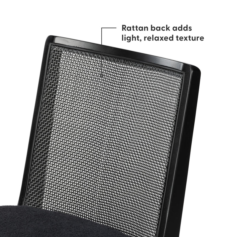 Black rattan mesh backrest on modern office chair with sleek black frame, breathable woven texture for light, relaxed style