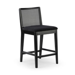 Black wooden counter-height stool with woven cane backrest, padded black upholstered seat and footrest — modern kitchen island bar seating