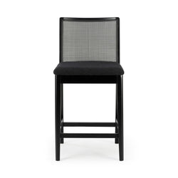 Black wooden counter stool with woven cane backrest, padded black upholstered seat and footrest, modern mid-century bar stool