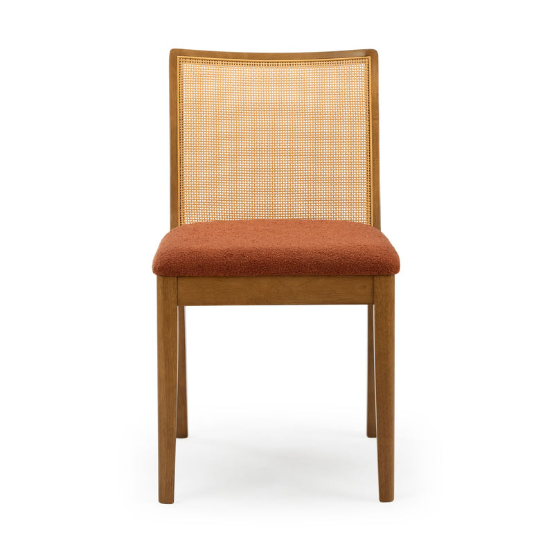 Wooden dining chair with natural cane back and rust orange upholstered seat, mid-century modern oak frame, front view on white background