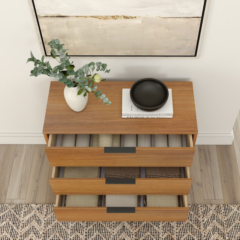 Modern wooden dresser with open drawers, decorative vase, books, and wall art in a stylish living room setting.