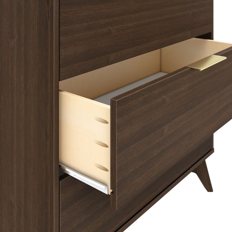Open dark wood dresser drawer with light wood interior and gold handle.