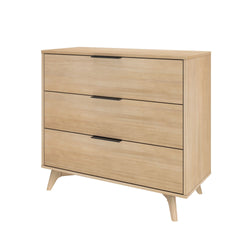 Modern Scandinavian-style wooden dresser with three drawers and sleek black handles.