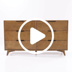 Mid-century modern six-drawer walnut dresser with tapered legs, black recessed handles and natural wood finish — stylish bedroom storage.