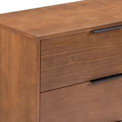 Close-up of modern walnut wood dresser two-drawer chest with matte black handles and smooth wood-grain finish, bedroom storage furniture