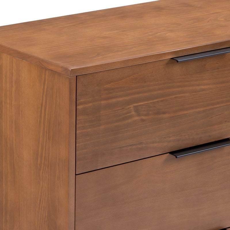 Close-up of modern walnut wood dresser two-drawer chest with matte black handles and smooth wood-grain finish, bedroom storage furniture
