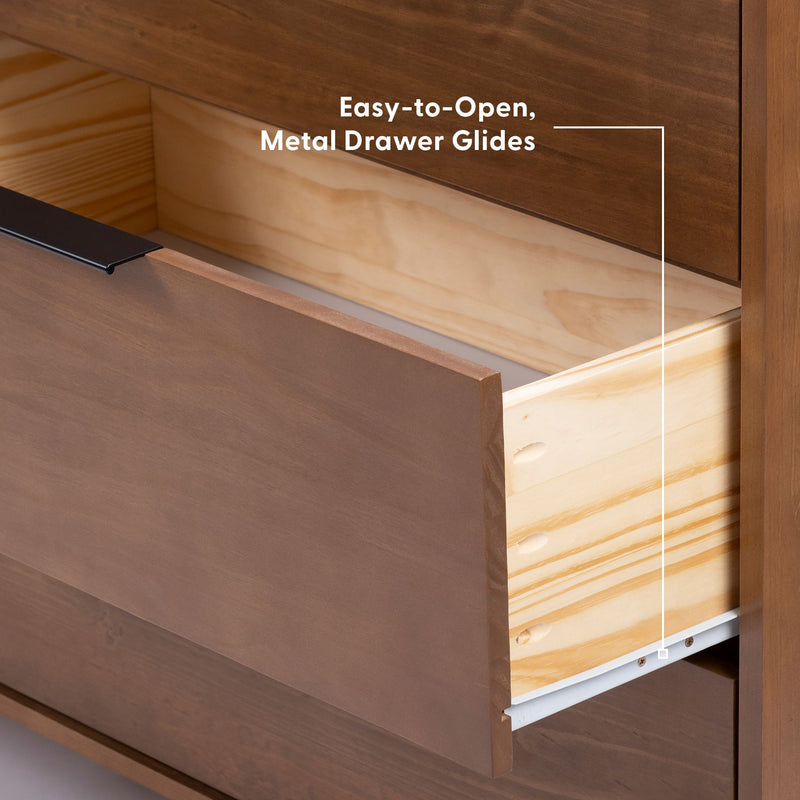 Close-up of an easy-to-open brown wooden dresser drawer with light pine interior and metal drawer glides