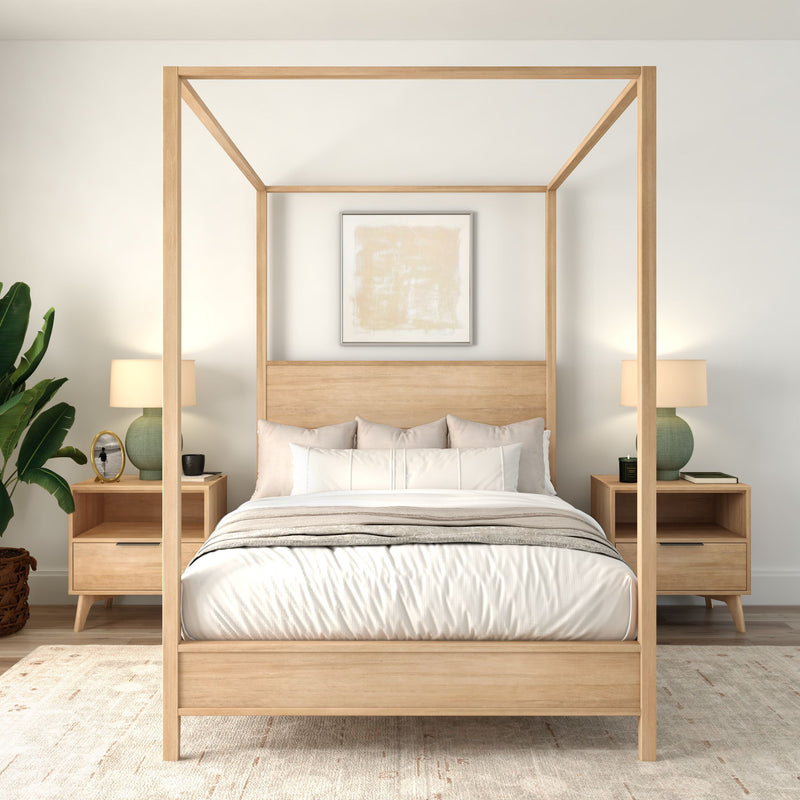 Minimalist Scandinavian master bedroom with light-wood four-poster bed, neutral bedding, matching nightstands, green table lamps and potted plant.