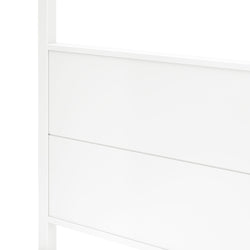 Close-up of white wooden headboard with horizontal groove detail, modern minimalist bedroom furniture