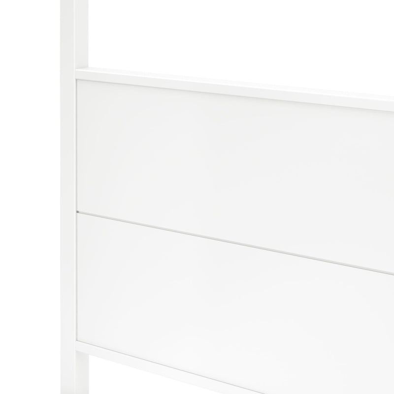 Close-up of white wooden headboard with horizontal groove detail, modern minimalist bedroom furniture
