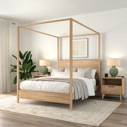 Minimal Scandinavian natural wood canopy bed with white bedding in a neutral master bedroom featuring nightstands, green lamps and an indoor plant