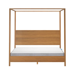 Modern wooden canopy bed frame with white mattress in minimalist design.