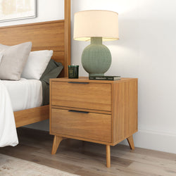 Wooden bedside table with lamp and books in modern bedroom setting.