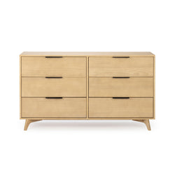 Mid-century modern six-drawer light wood dresser with black metal handles and tapered legs — minimalist bedroom storage in a natural maple finish
