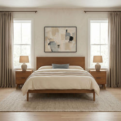Modern minimalist bedroom with mid-century wooden bed, neutral beige bedding, matching wooden nightstands and lamps, abstract wall art and large curtained windows