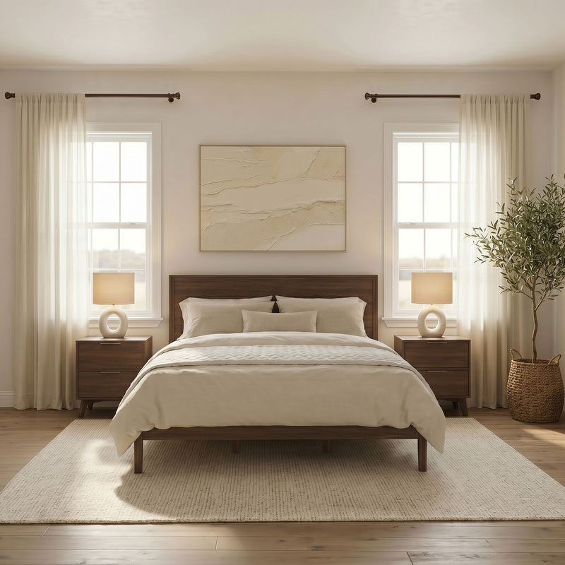 Modern neutral master bedroom with wooden bed frame, beige bedding, sheer curtains, bedside lamps and potted plant