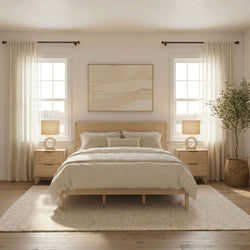 Minimalist neutral bedroom with wooden platform bed, beige bedding, matching nightstands, ceramic lamps, sheer curtains and abundant natural light