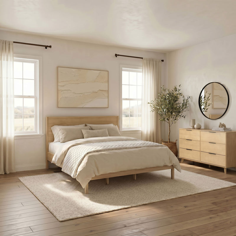 Cozy minimalist neutral bedroom interior with wooden platform bed, beige bedding, textured wall art, sheer curtains, round mirror and potted plant