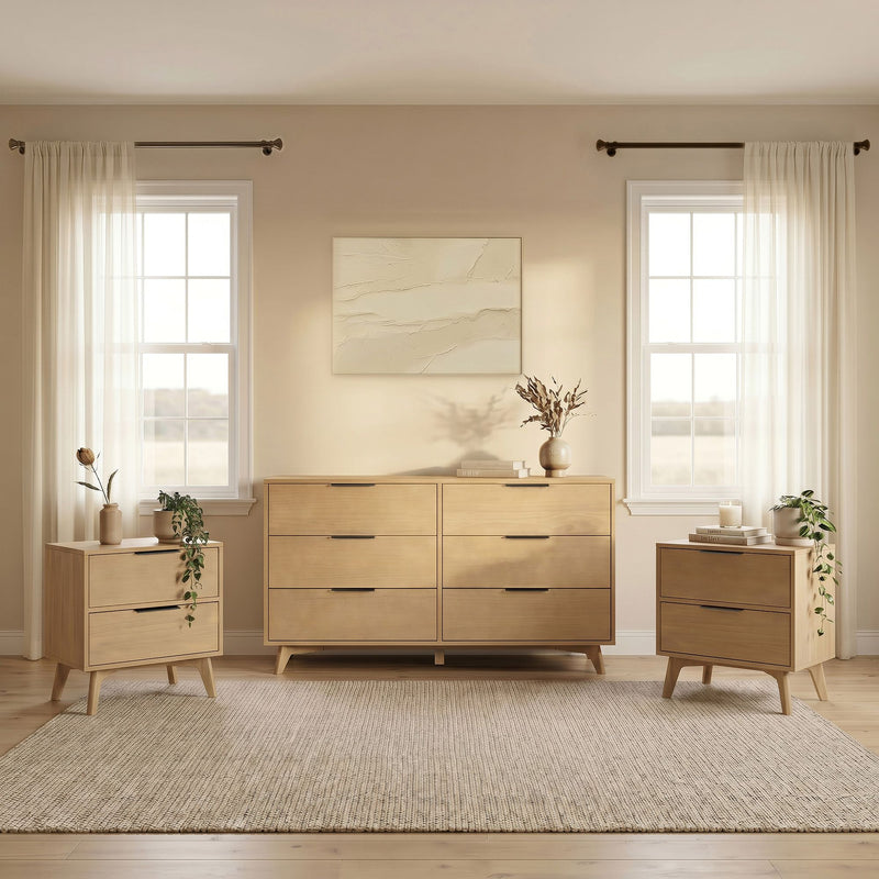 Minimalist Scandinavian bedroom interior with light wood dresser and matching nightstands, sheer white curtains over twin windows, textured beige wall art, vases with dried foliage and potted plants on a woven rug — neutral modern bedroom decor