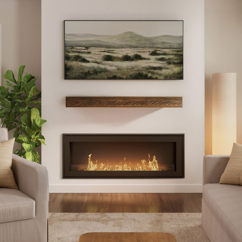 Modern living room with recessed linear gas fireplace and wooden floating mantel, landscape wall art above, neutral sofas, potted plant and hardwood floors