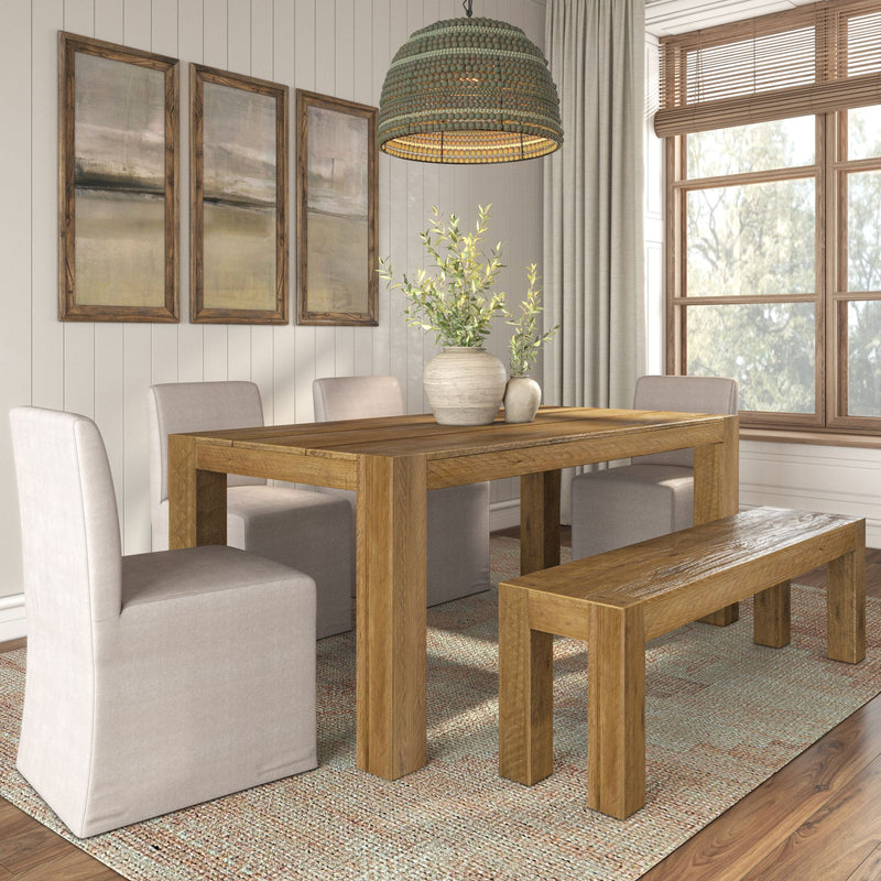 Modern dining room featuring rustic wooden table and bench with upholstered chairs and woven pendant light.