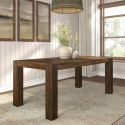 Elegant wooden dining table in a modern room with decorative vases and natural light.