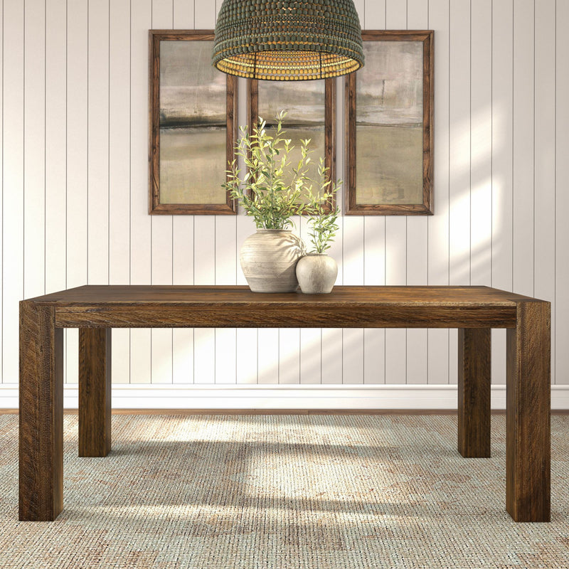 Modern wooden dining table with vases, wall art, and pendant light in cozy interior setting.