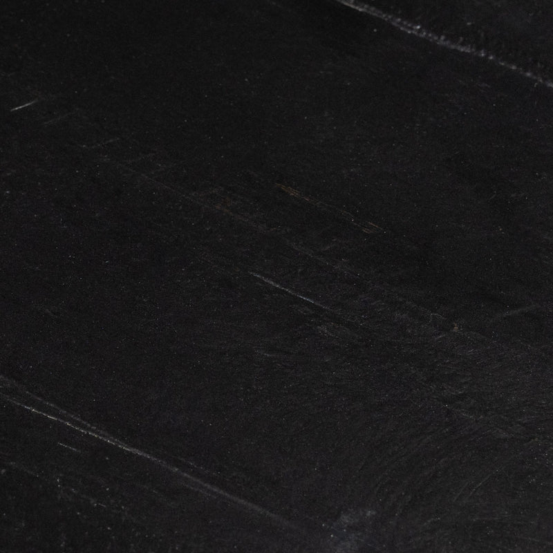 Close-up of a textured black surface for artistic background or design concepts.