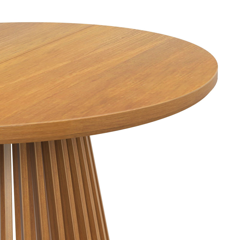 Round wooden dining table with ribbed base design.