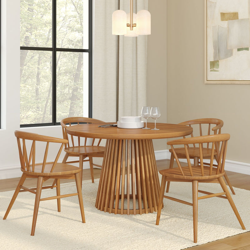 Modern wooden dining table set with four chairs in a stylish contemporary dining room.