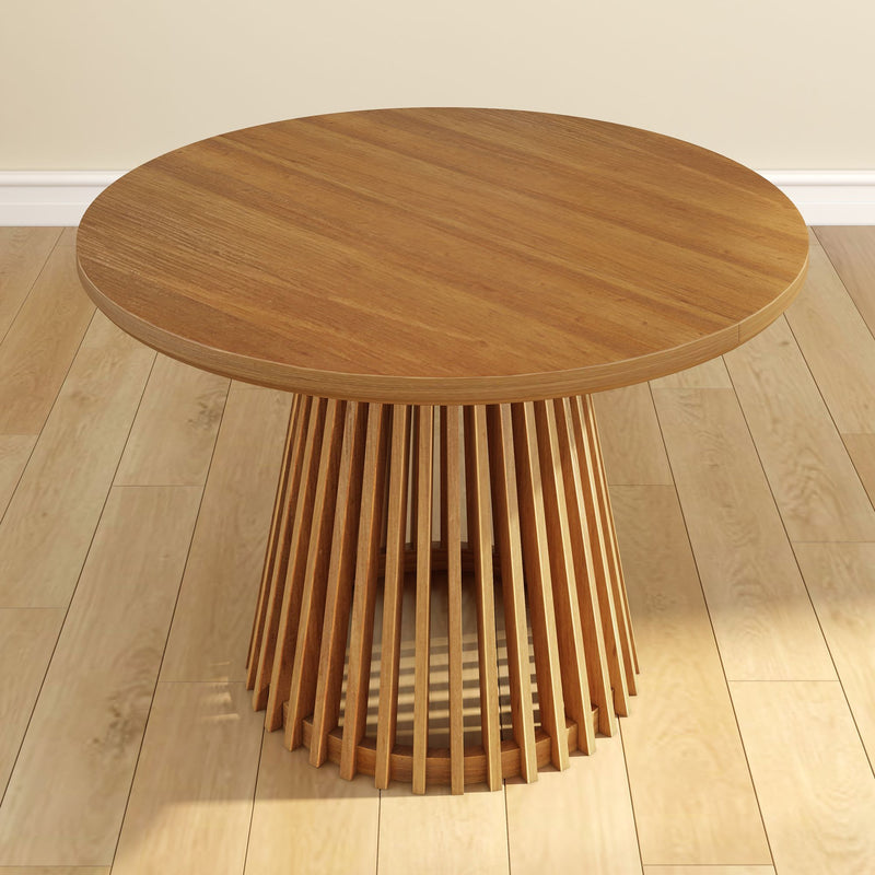 Round oak coffee table with slatted design on wooden floor.