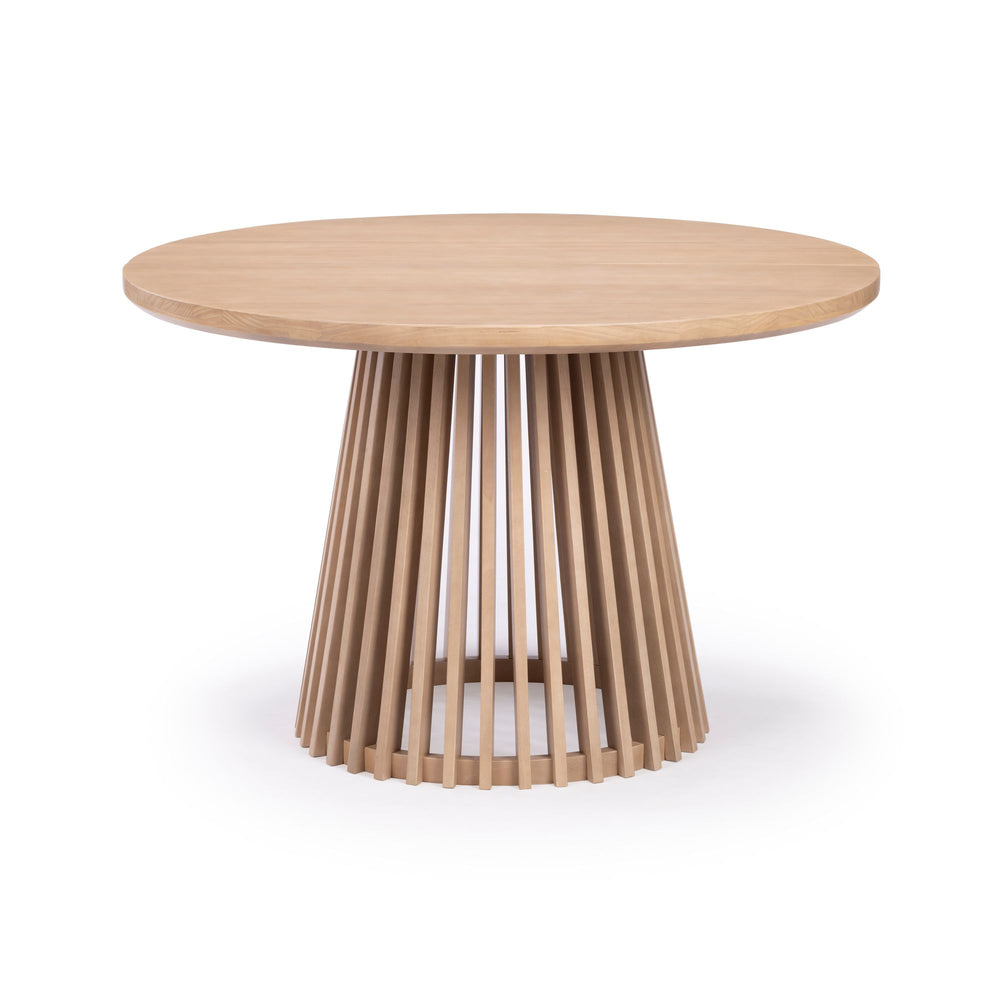 Round wooden dining table with unique vertical slat base design.
