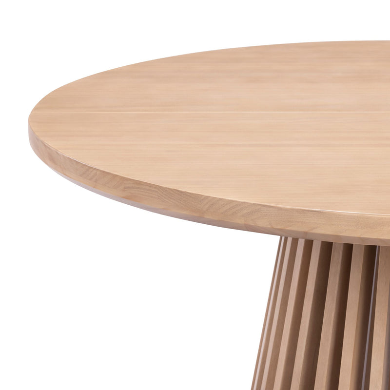 Round wooden dining table with sleek design and smooth finish.