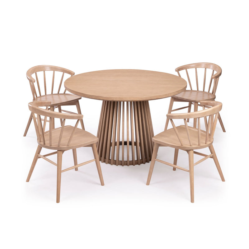 Round wooden dining table set with four matching chairs in a modern design.