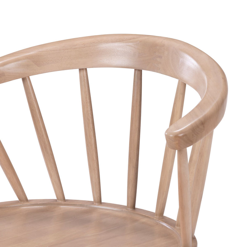 Elegant wooden chair with curved backrest and spindle design for modern home decor.