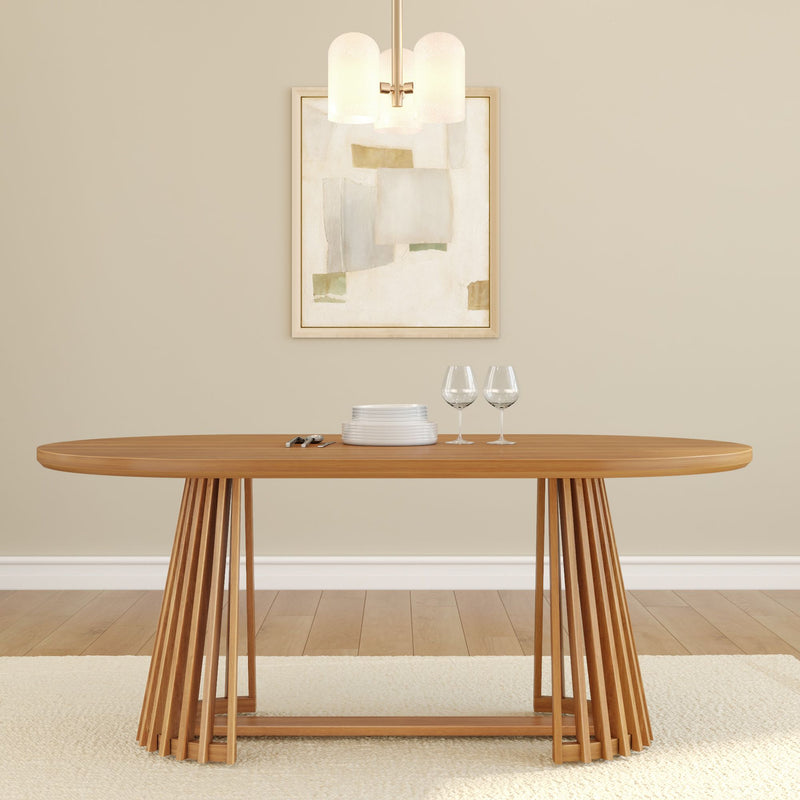 Modern wooden dining table with abstract wall art and table setting featuring elegant wine glasses and plates.