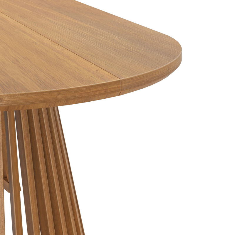 Modern round wooden dining table with unique leg design.
