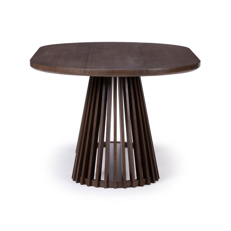 Modern round wooden dining table with a slatted base design on a white background.