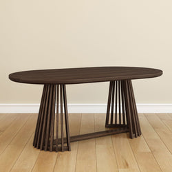 Oval walnut dining table with slatted pedestal base on light hardwood floor in a minimalist modern dining room