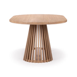 Modern wooden dining table with unique slatted pedestal base on white background.