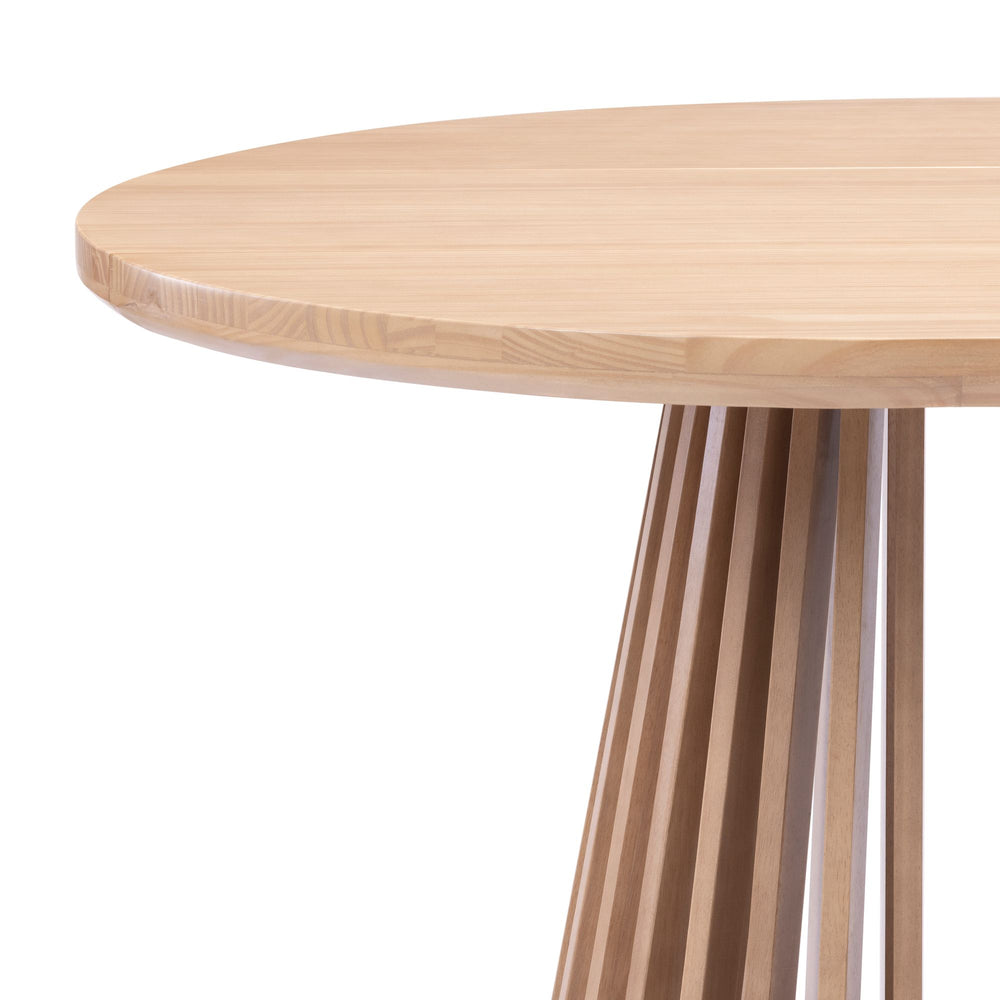 Round wooden dining table with unique slatted base design.