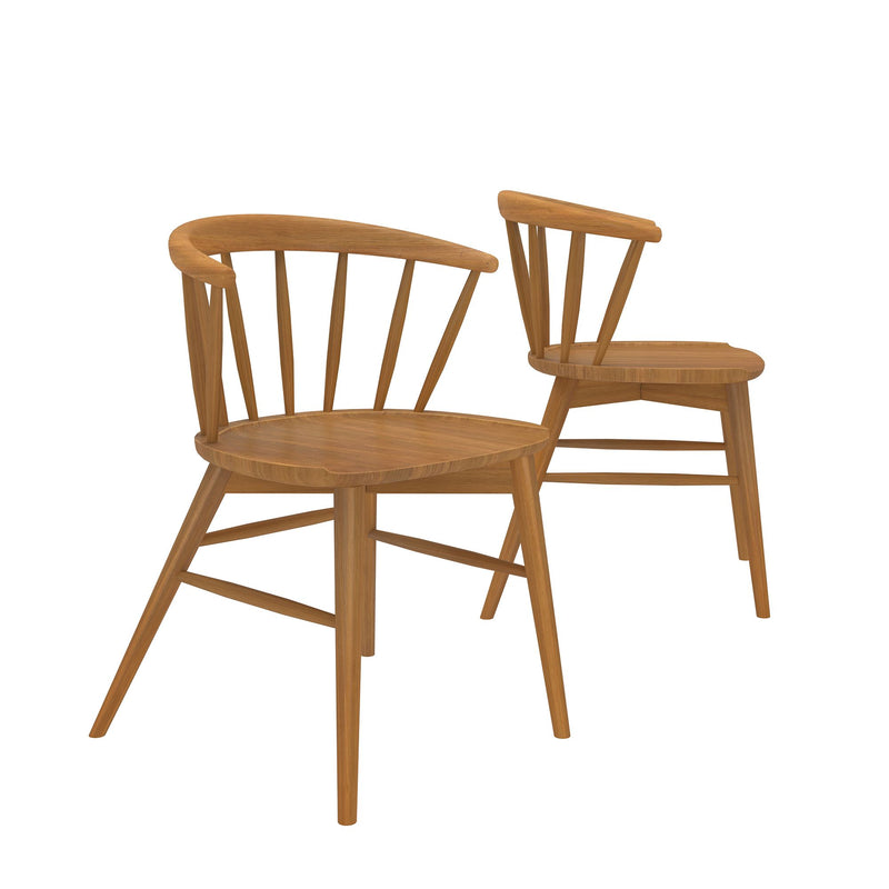 Two mid-century modern wooden dining chairs with spindle backs.