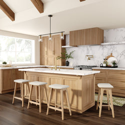 Modern kitchen with wooden cabinets, marble countertops, and an island with bar stools.