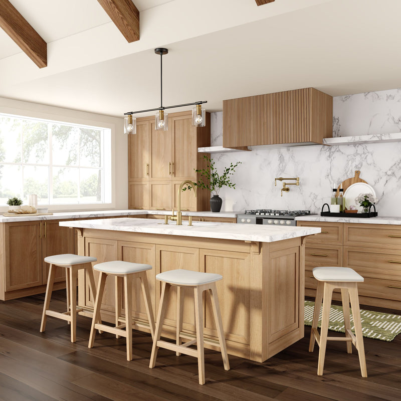 Modern kitchen with wooden cabinets, marble countertops, and an island with bar stools.