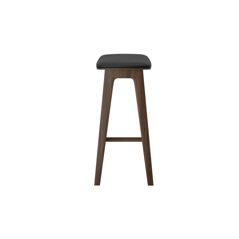 Mid-century modern dark walnut wooden bar stool with black upholstered, backless seat and footrest on white background