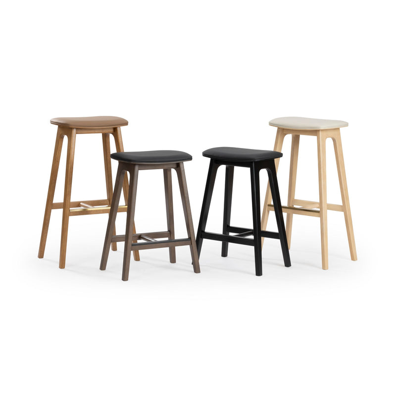 Four modern wooden bar stools with padded seats in various colors, perfect for kitchen and dining areas.
