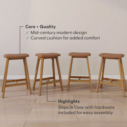 Set of four mid-century modern wooden bar stools with brown upholstered curved seats and tapered legs on a light hardwood floor — counter-height kitchen stools that ship in one box with hardware for easy assembly.