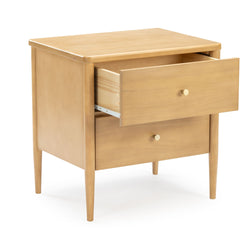 Mid-century modern light oak nightstand bedside table with two drawers, brass knobs and tapered legs, one drawer partially open